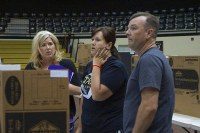 Image: Judges Charla Sparks, Casey Holden and Paul Cockerham decide which entry is First Place.