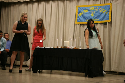 Image: Jesica Wilkins, Brianna Riddle and Monserrat Figueroa prepare to induct the new members.