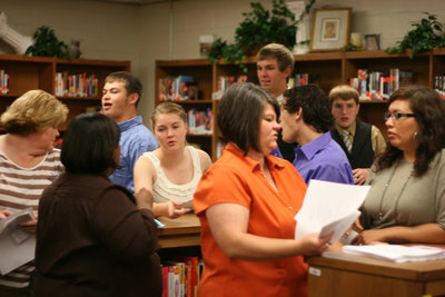 Image: Family and friends gather in the library for refreshments and socializing.