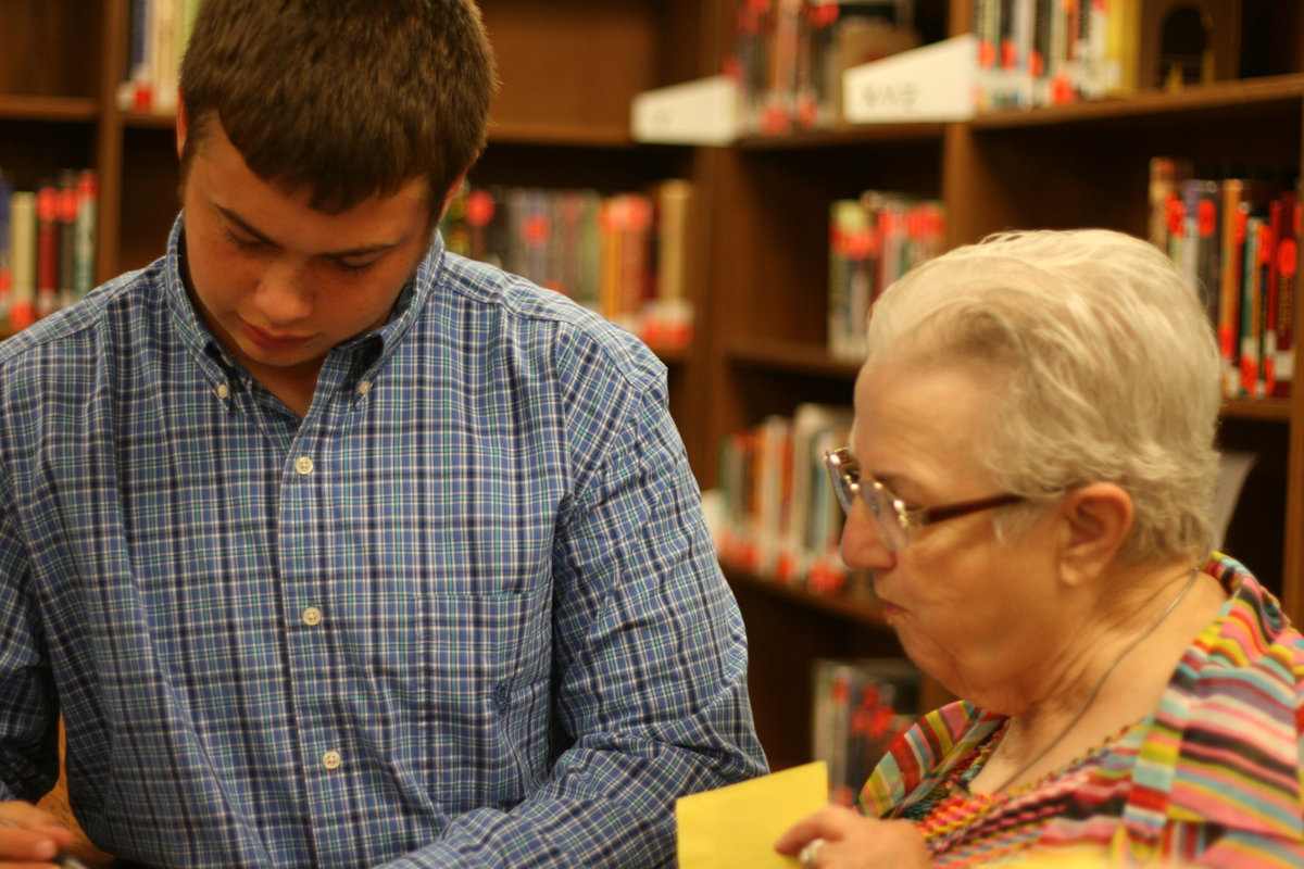 Image: Zain Byers and grandmother, Ann Byers, enjoy the refreshments after the ceremony.