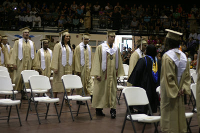 Image: Mrs. Moreland and Mr. Joffre lead the graduating class to their seats.