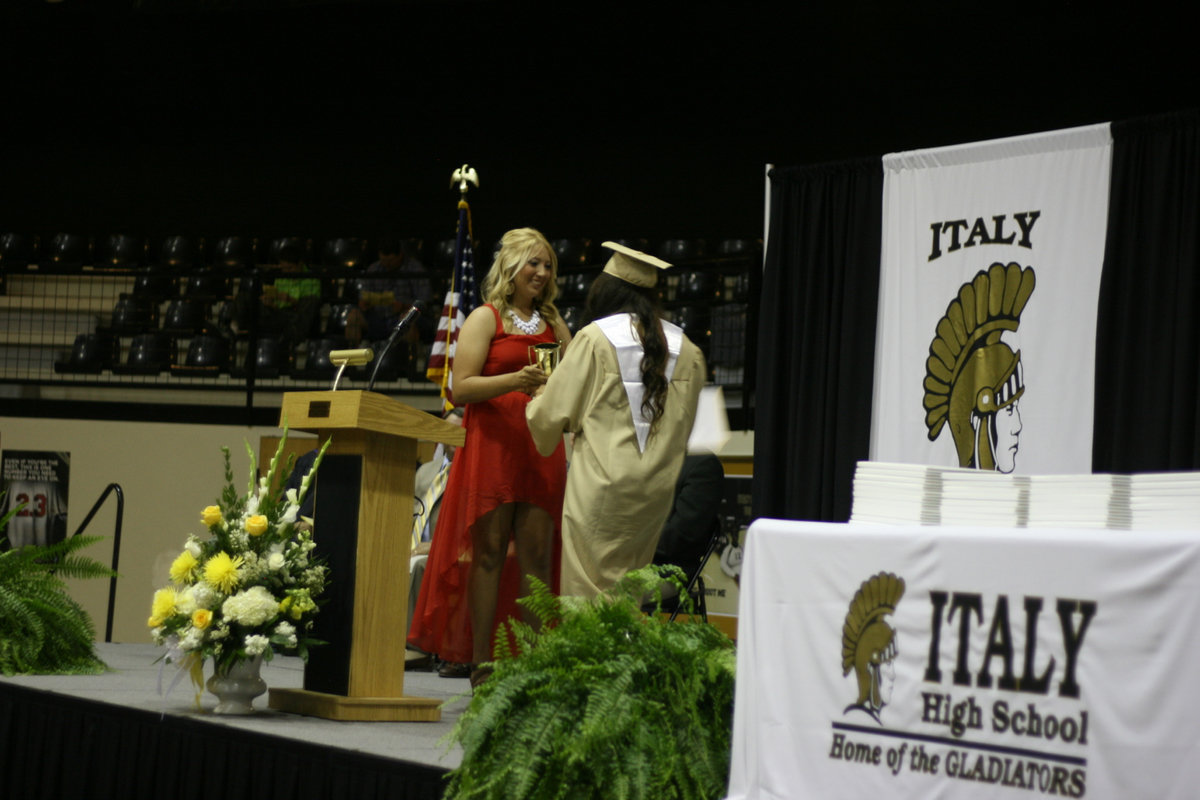 Image: Sisters, Alyssa and Megan Richards, exchange hugs as the Willis Cup is awarded to Alyssa.