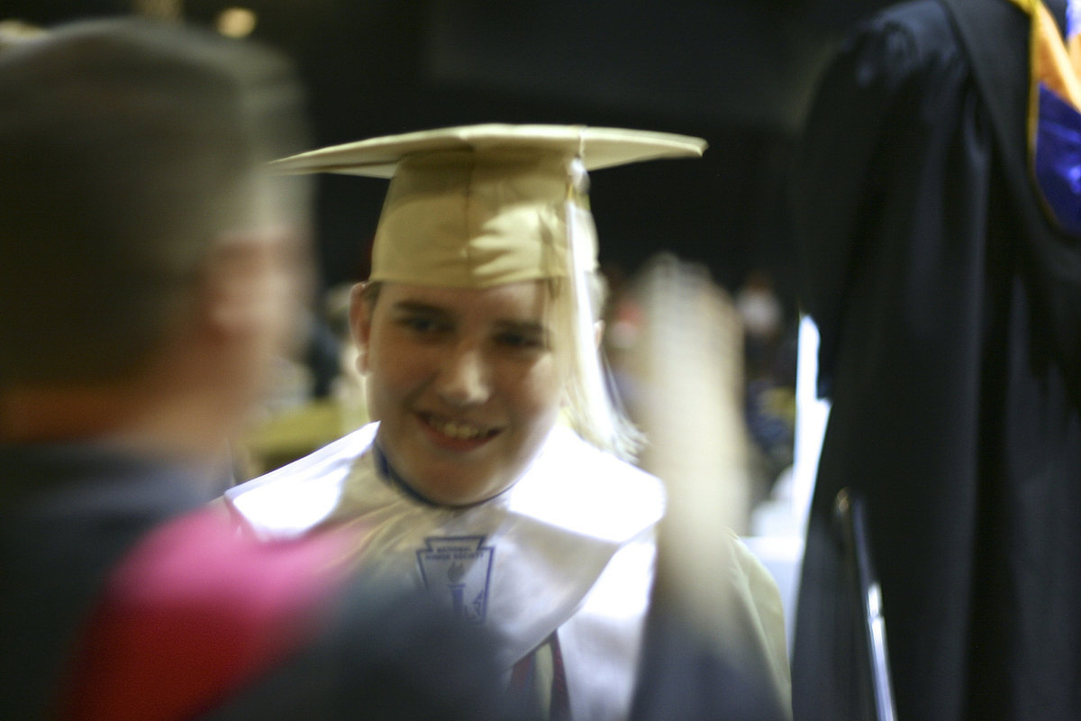 Image: Brett Kirton has his tassel moved to the other side.