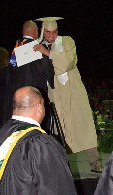 Image: Principal Lee Joffre congratulates 2013 Italy High School graduate Zackery Boykin after Boykin received his diploma.