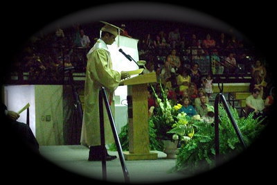 Image: Senior Reid Jacinto addresses the coliseum as he and his classmates prepare for their final moments at Italy High School.