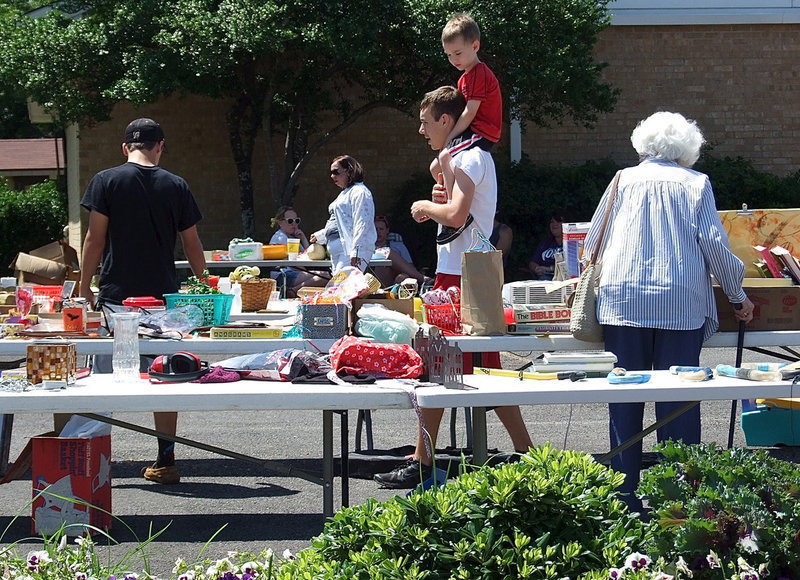 Image: Levi McBride, Ryan Connor and his little brother, Trenton, stop by to pick out some goodies.