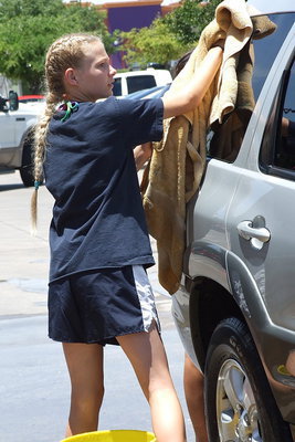 Image: Italy Jr. High Cheerleader, Taylor Boyd, takes care of a customer.