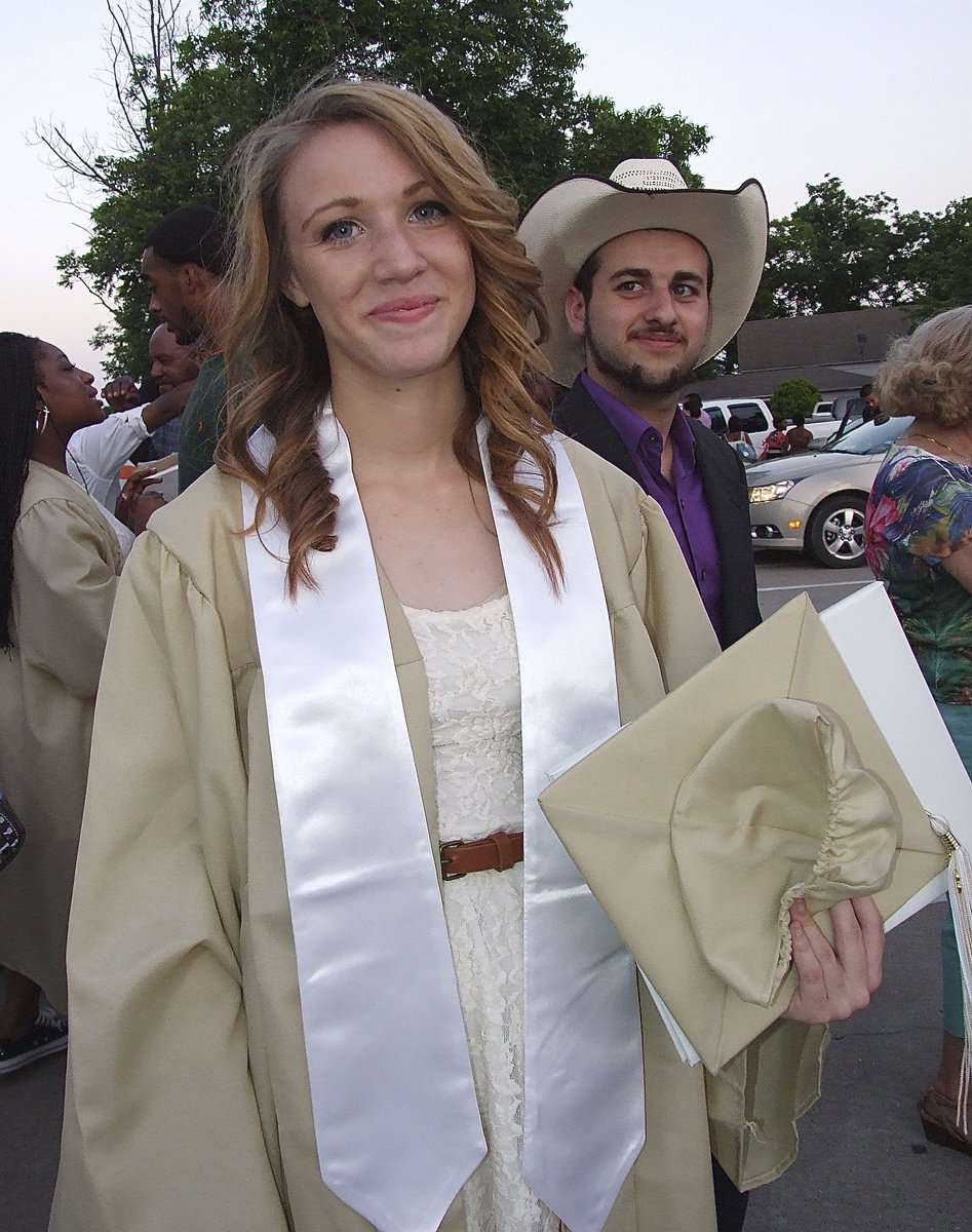 Image: Brooke Miller begins to break a smile after becoming a 2013 graduate of Italy High School.