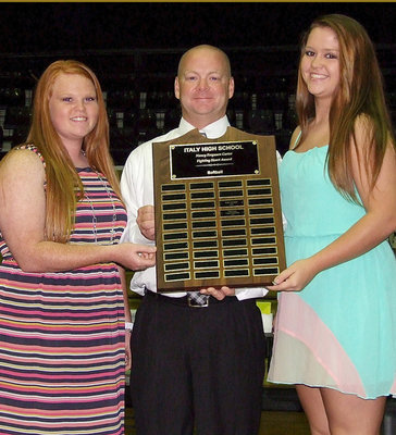 Image: Softball assistant coach Michael Chambers presents senior Katie Byers and junior Paige Westbrook with the 2013 Nancy Ferguson Carter Fighting Heart Award in Softball.