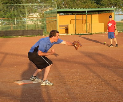 Image: Josh Droll makes the grab at first base for a simulation out. Droll and his Italy Firefighter teammates are looking to avoid a repeat of last year’s loss to the Italy Police Department during the 1st annual Guns vs. Hoses charity event.