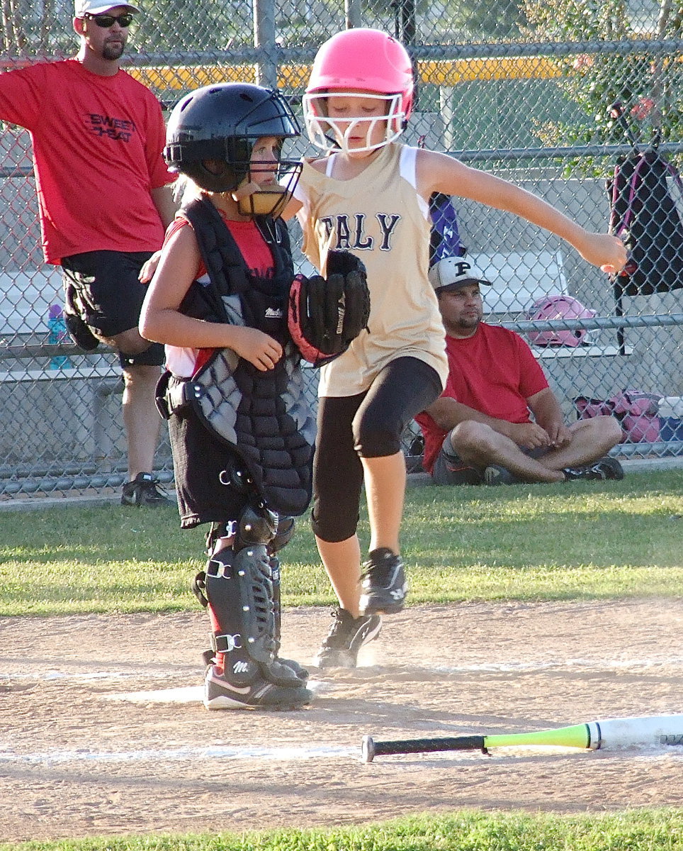 Image: Karley Sigler scores for Italy during a 9U coach pitch championship softball matchup against Waxahachie.