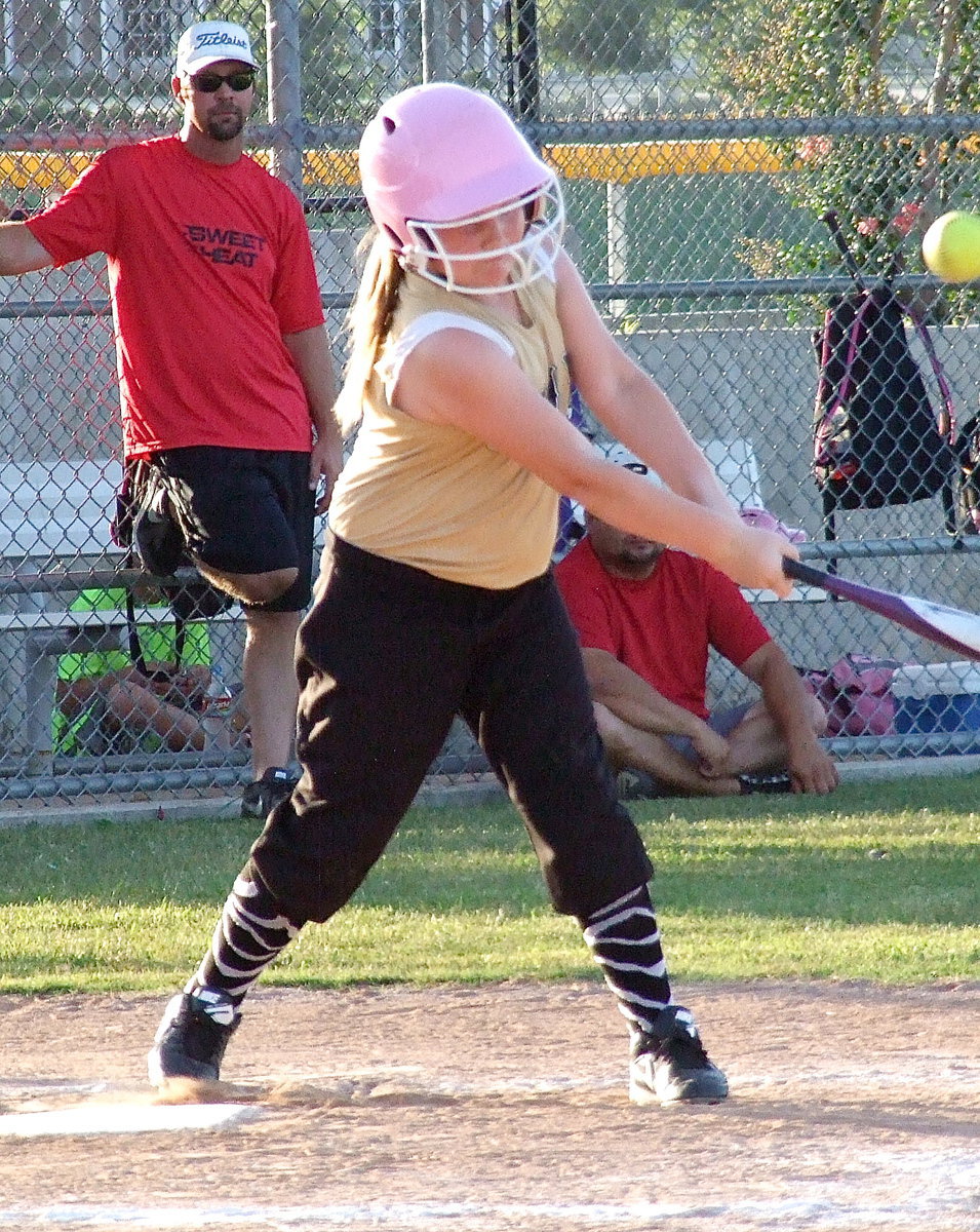 Image: Italy’s Brianna Hall hits one over the Waxahachie’s infield.