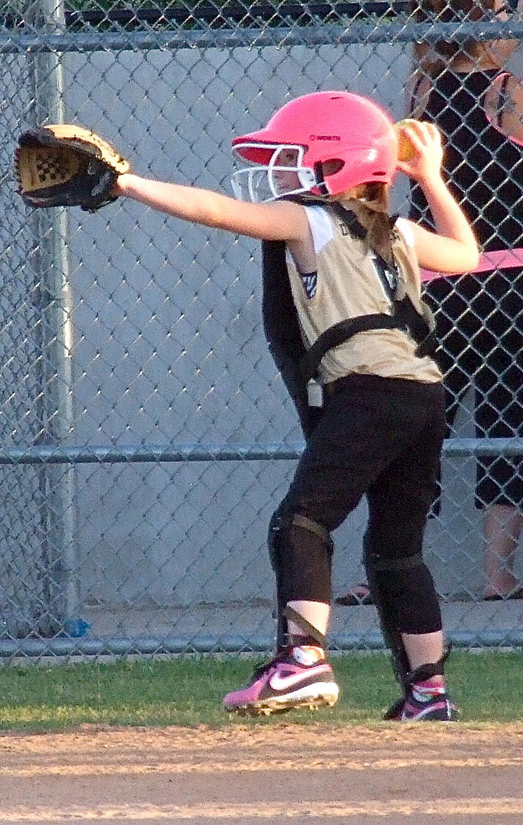 Image: Desi Miller throws the ball back to the pitcher’s mound.