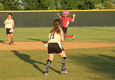 Image: Italy shortstop, Kinley Cate holds a Waxahachie runner at second base.