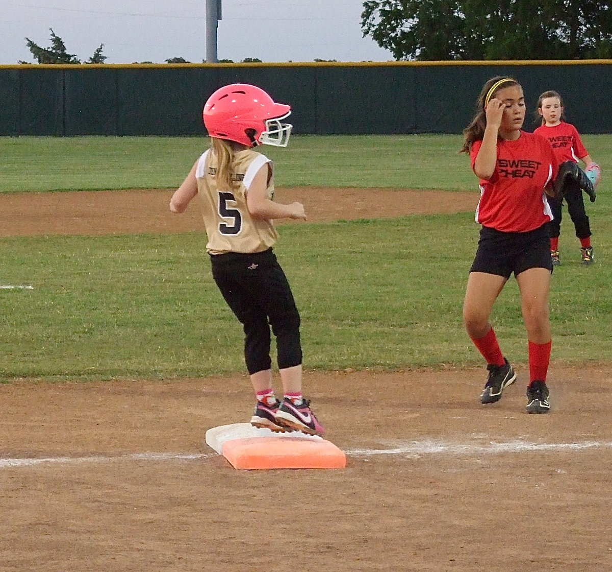 Image: Little, Desi Miller comes up big in the top of the fifth-inning with a single.