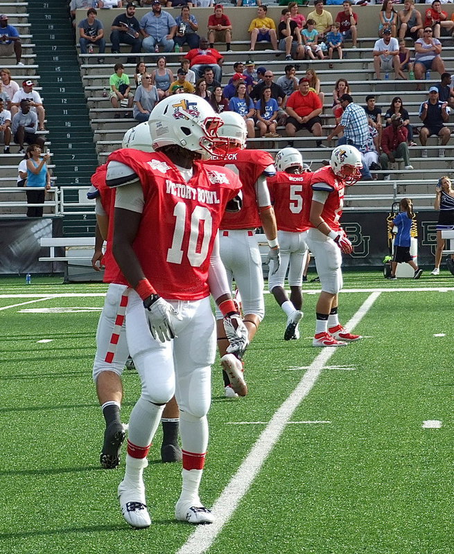 Image: The Red Team lines up for the opening kickoff with Italy’s Ryheem Walker(10) ready to make a play.