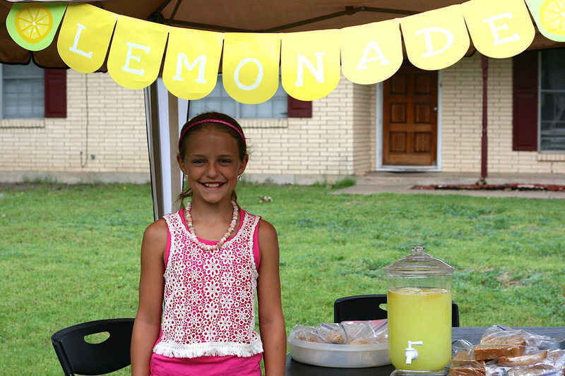 Image: Brooke Gage took an opportunity to sell lemonade to the cyclists, saving for a vacation in Port Aransas.