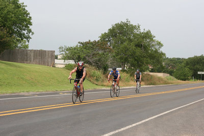 Image: The 63 miles riders head for the rest stop where there are cold peaches and water.