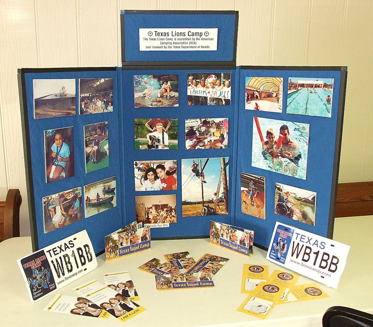 Image: A display features the Texas Lion’s Camp which Lion’s Club members from all over the State help make possible for children ages 7-16 living with physical disabilities, children 8-15 having type 1 diabetes and Down syndrome kids 12-16 years old. Campers generally attend year-after-year with the TLC being a special event in their lives.