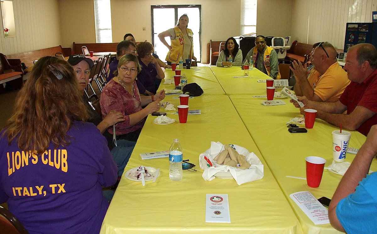 Image: Invited guests listen intently as Meg Lyons and Flossie Gowin explain different functions of Lion’s Club International, and more specifically, the Italy chapter which is needing to grow its membership.