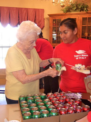 Image: Gwen Somerville (resident) is helping serve the nurses aides with cake and soda.