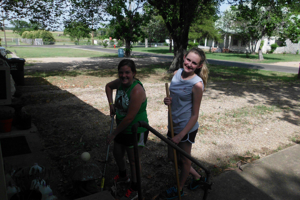 Image: Reagan Cockerham and Kelsey Nelson show Mrs. McNeely service with a smile.