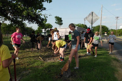 Image: Cleaning the memorial garden was hard work for First Baptist Youth and sponsors.