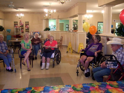 Image: Residents singing happy birthday to James and Doris.