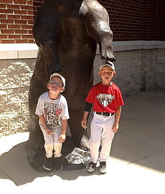 Image: Austin and Dustin receive pats of encouragement from the Baylor Bears statue.