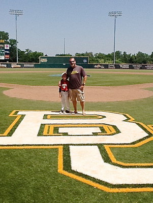 Image: Dustin Duke poses with his dad, Shane Long, atop the Baylor University logo.