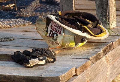 Image: The helmet and gloves of Italy firefighter, Captain Michael Chambers.