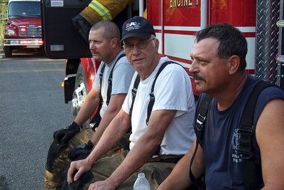 Image: Forreston firefighters take a breather with the situation under control.