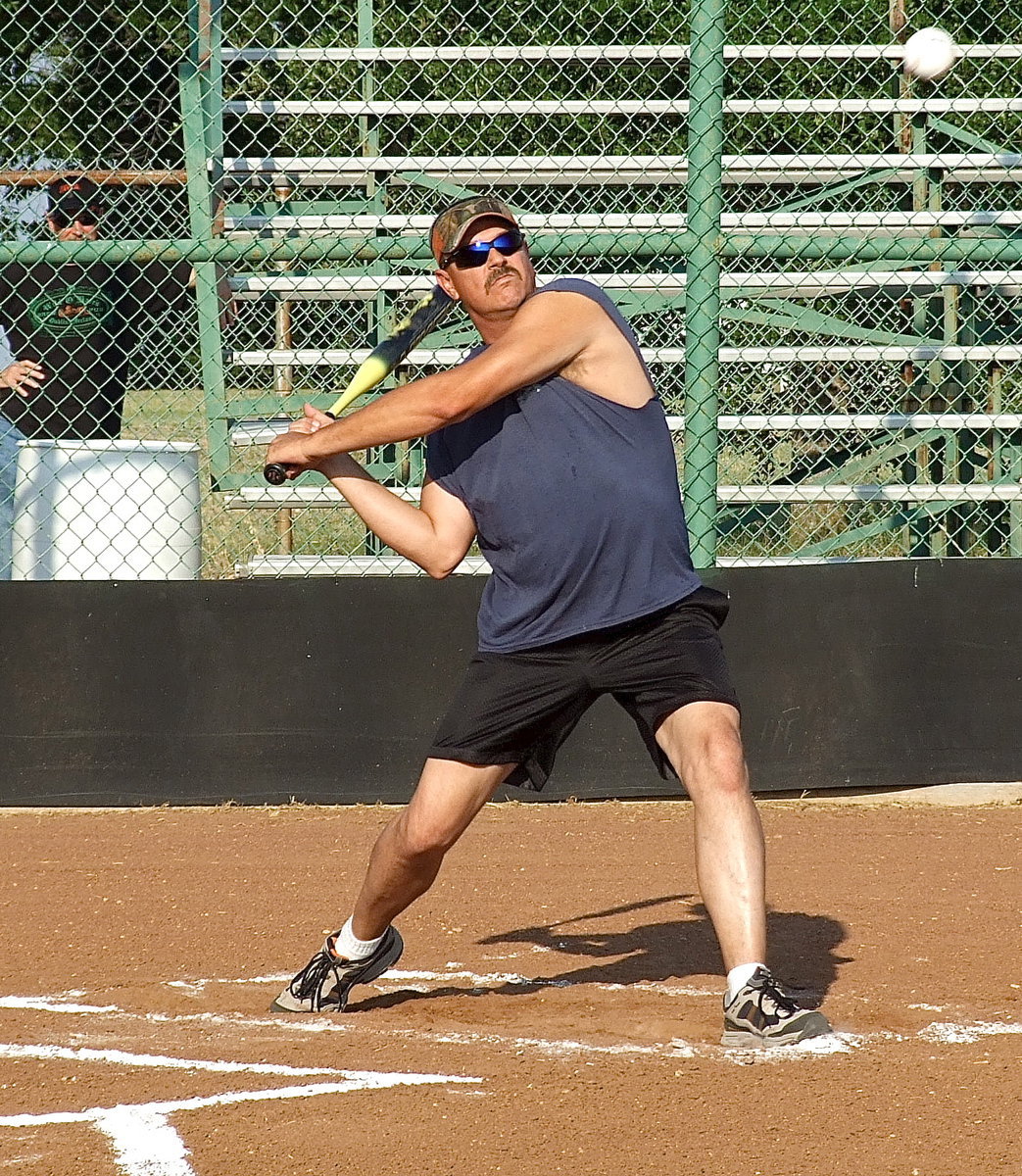 Image: Forreston’s firefighter Bobby McBride takes a mighty swing during the homerun derby.