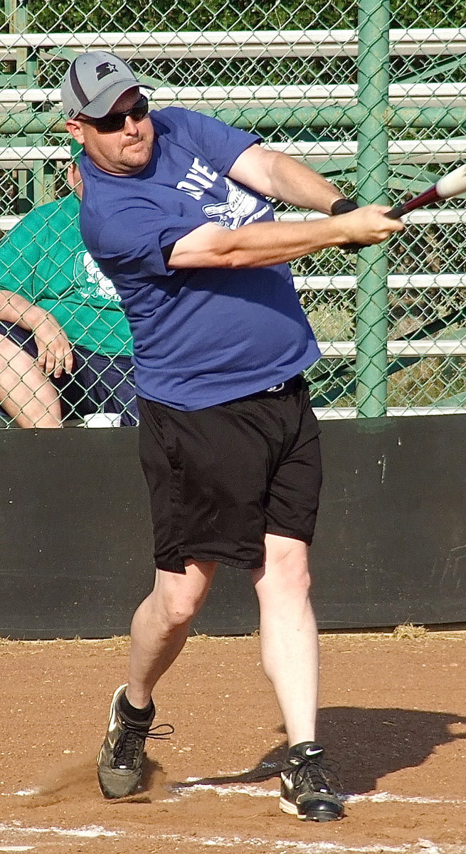 Image: Italy Police Officer Shawn Martin takes aim during the homerun derby.