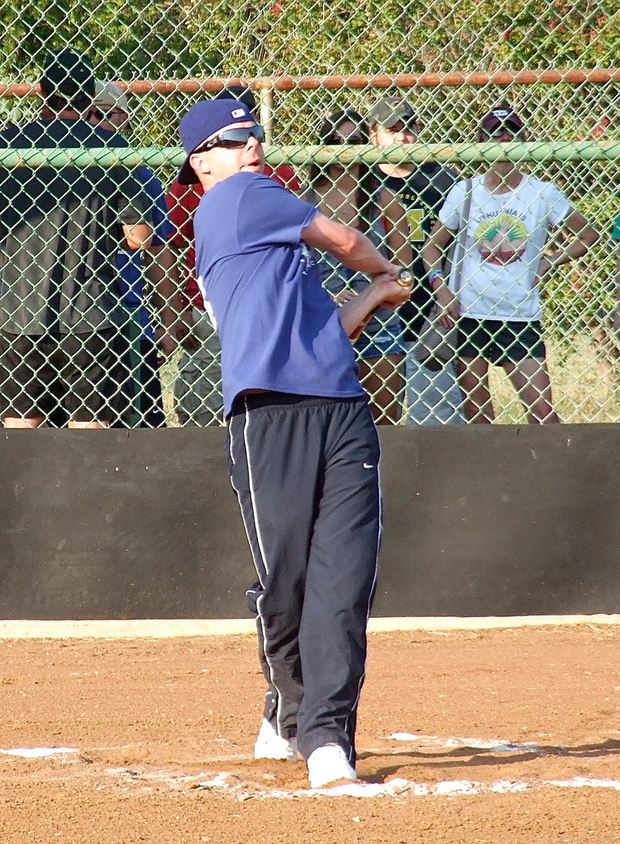 Image: Italy Italy Police Officer Daniel Pitts tries for a pair of Ranger’s tickets during the homerun derby.