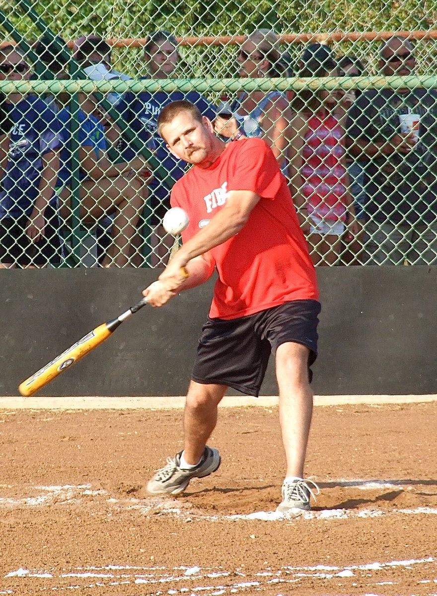 Image: Forreston Firefighter Daniel Ballard tries his luck during the homerun derby and later hit one out of the park during the game.