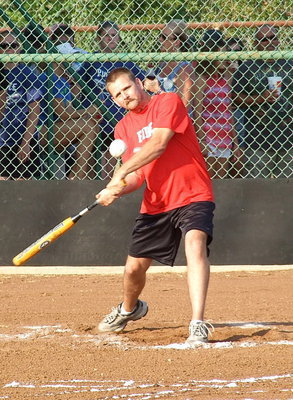 Image: Forreston Firefighter Daniel Ballard tries his luck during the homerun derby and later hit one out of the park during the game.