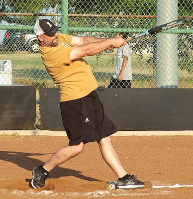 Image: Italy ISD Principal Lee Joffre targets the sky just beyond the left field fence during the homerun derby.