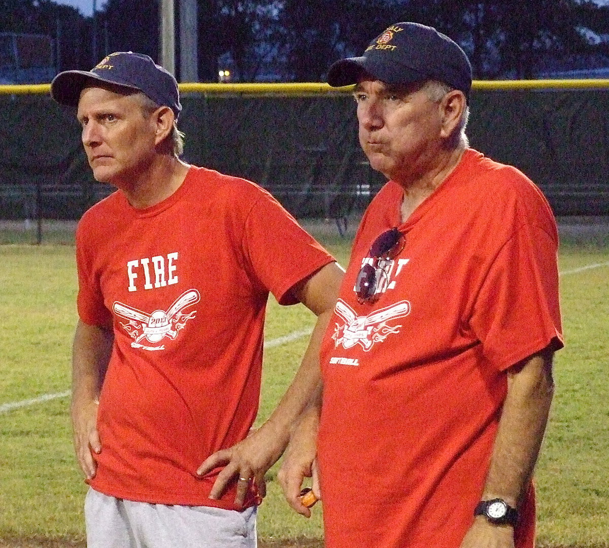 Image: Firefighter Randy Boyd and Italy Fire Chief/Coach Donald Chambers realize all you can do know is throw some water on it and let it play itself out.