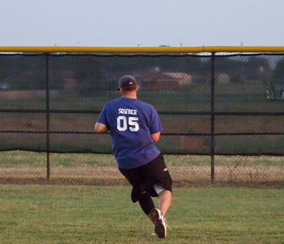 Image: Adam Sowder makes an over-the-shoulder catch from his shortstop position.