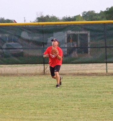 Image: Firefighter Jackie Cate makes the catch as the rover in the outfield.