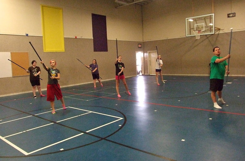 Image: Instructor Scooter Spicer has the group use their poles without the flags to achieve more accurate movements.