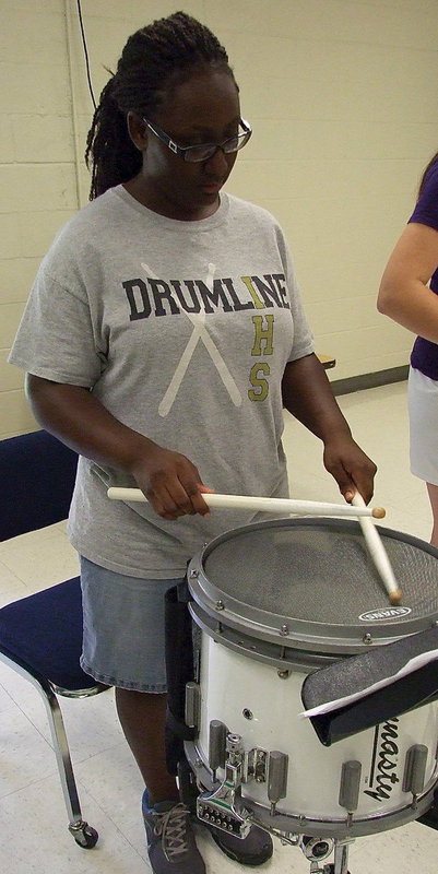 Image: Brenya Williams finds the rhythm with her snare drum.