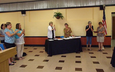 Image: Mrs. Margie Davis receives a standing ovation from those in attendance upon receiving her commemorative plaque.
