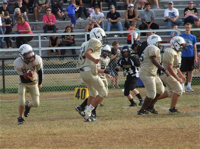 Image: Ryder Itson(2) follows Jonathan Salas(82) and his front line during a kick return.