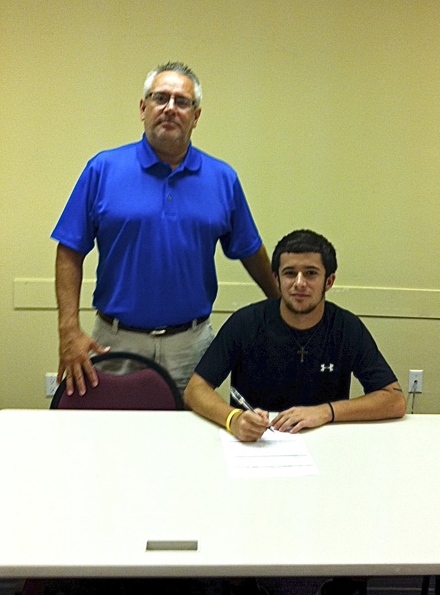 Image: Italy High School’s 2013 graduate, Caden Jacinto with his father, Vincent Jacinto, after Caden signs his commitment letter to play baseball for Mountain View Community College of Dallas.