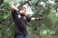 Image: Hunter Hinz shooting in the compound bow junior division of 3D archery at the State 4-H Games.