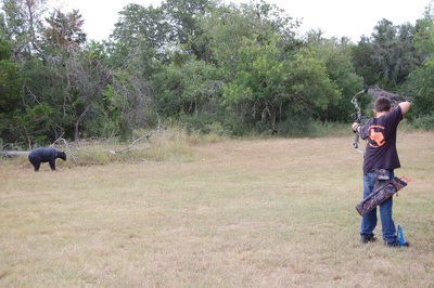 Image: Hunter Hinz shoots a long range bear in the junior division of 3D archery.