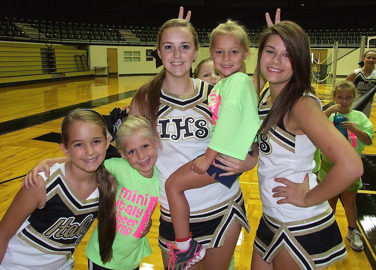 Image: Italy cheerleaders Karley Nelson, Kelsey Nelson and Kristian Weeks certainly had their hands full during the camp as Ariana Walker and Charlea Padilla keep the veterans on their toes. Photo bomb courtesy of Brianna Hall.