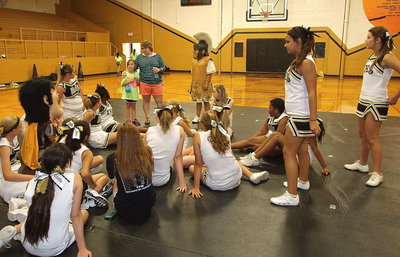 Image: Varsity cheer sponsor Catherine Hewett thanks the cheerleaders for the help with the mini camp.